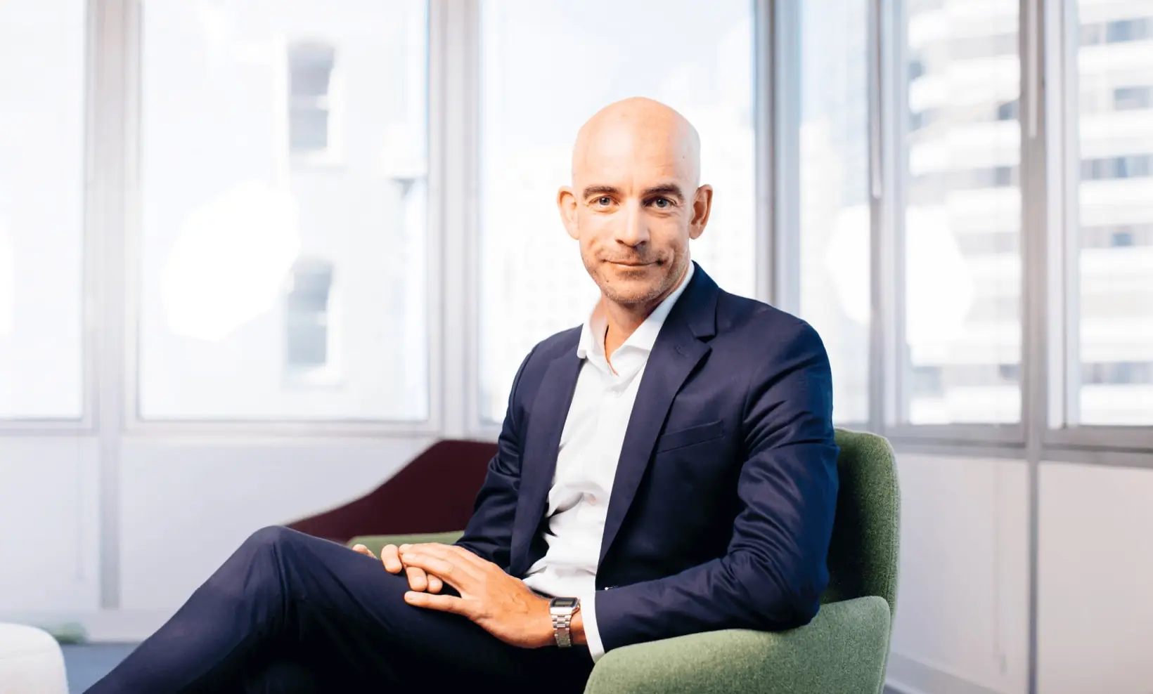 Nikolaj Koester seated in an office, smiling
